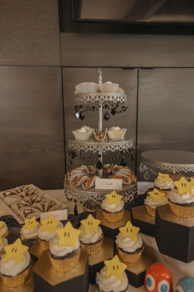 Mario themed cupcakes and deserts laid out on a table. 